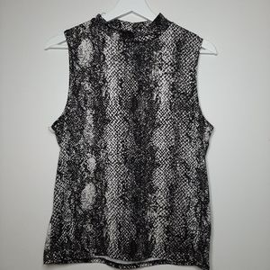 Soft, sleeveless, turtle-neck shirt
